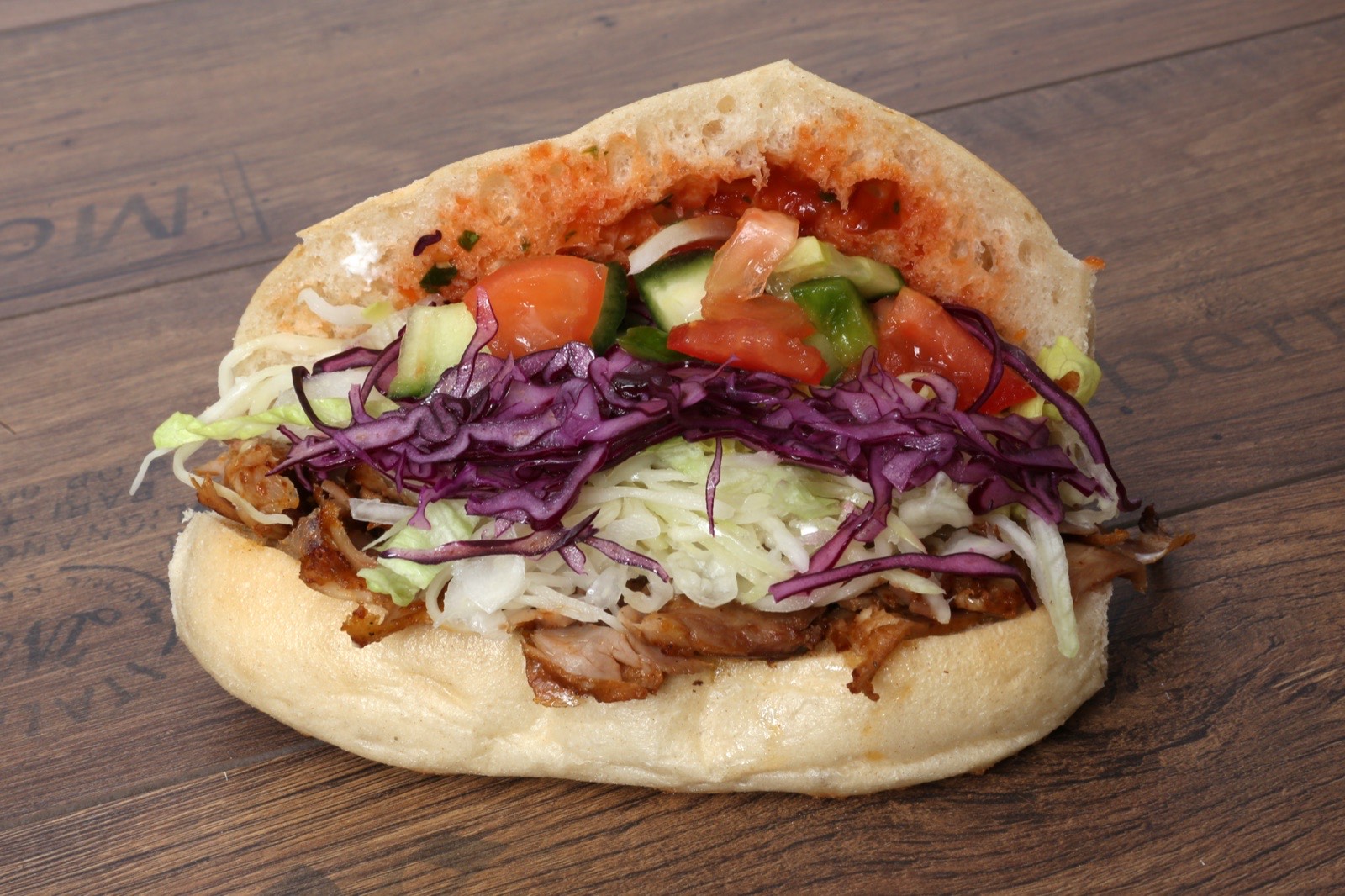 Flame-lit vertical döner spit