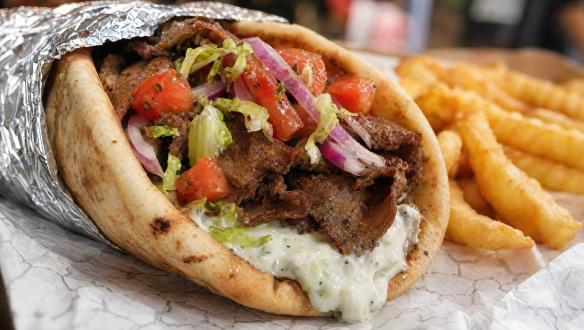 A classic Turkish döner pita from Baba Döner NYC — hand-carved meat, vegetables, and sauce in fresh bread
